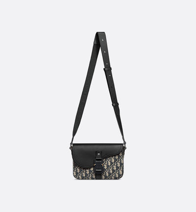 Bolso bandolera pequeño con solapa en color negro y beige de Saddle